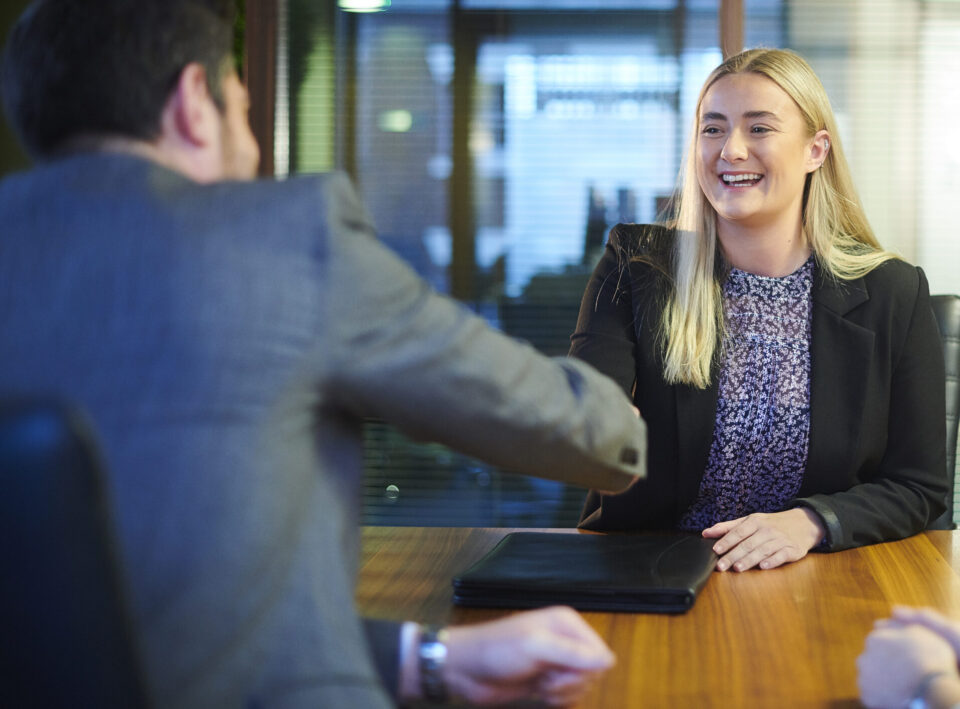 student graduate with interview panel